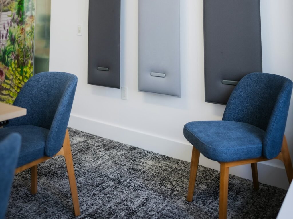 Grey acoustic felt panels on a meeting room wall