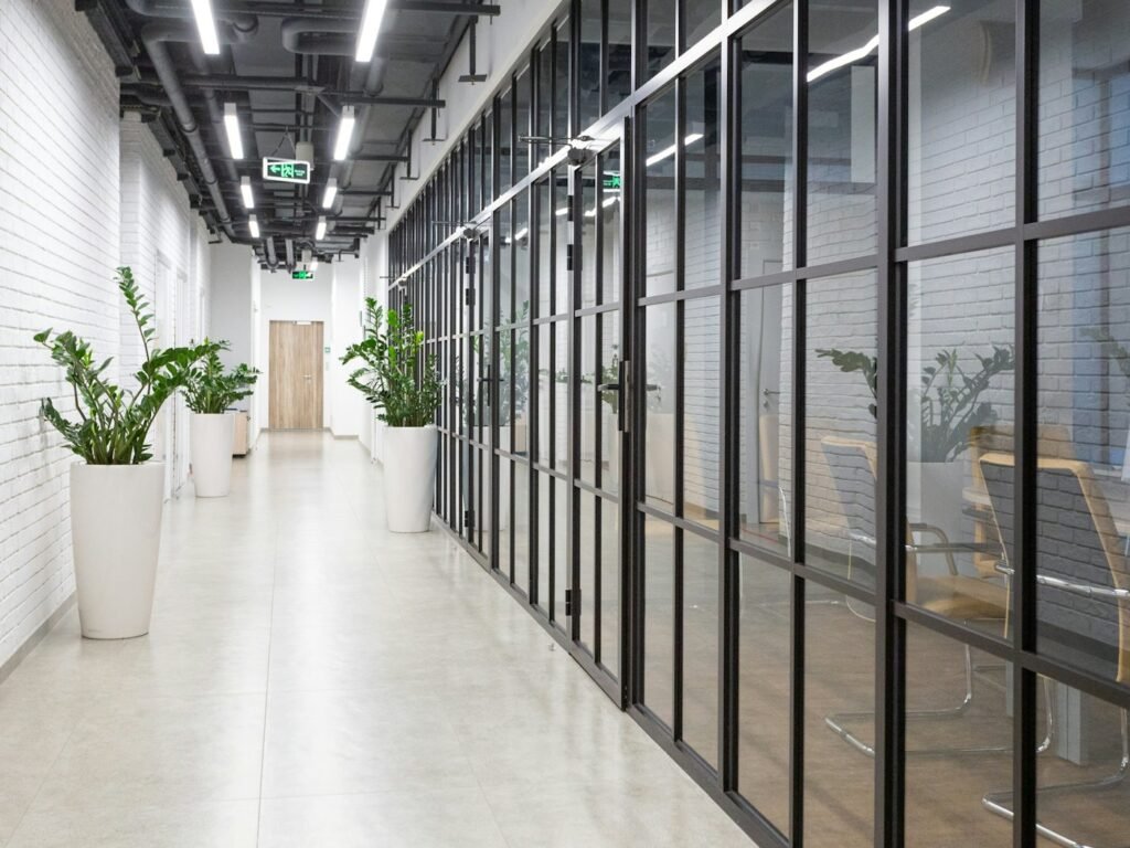 Corridor lined with framed glass partitions