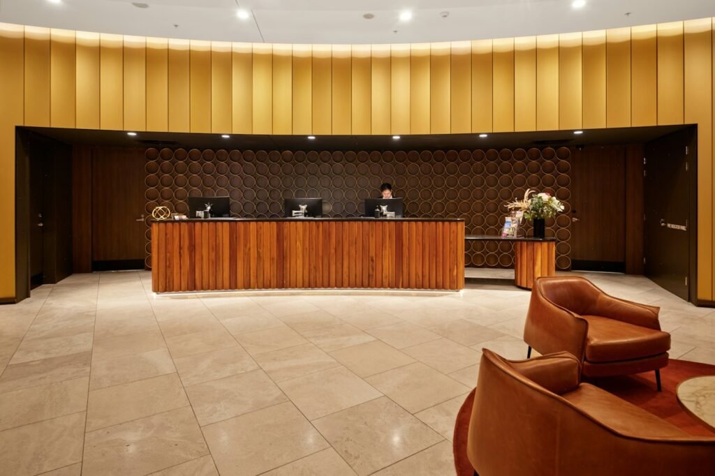 Hotel reception desk with timber panelling
