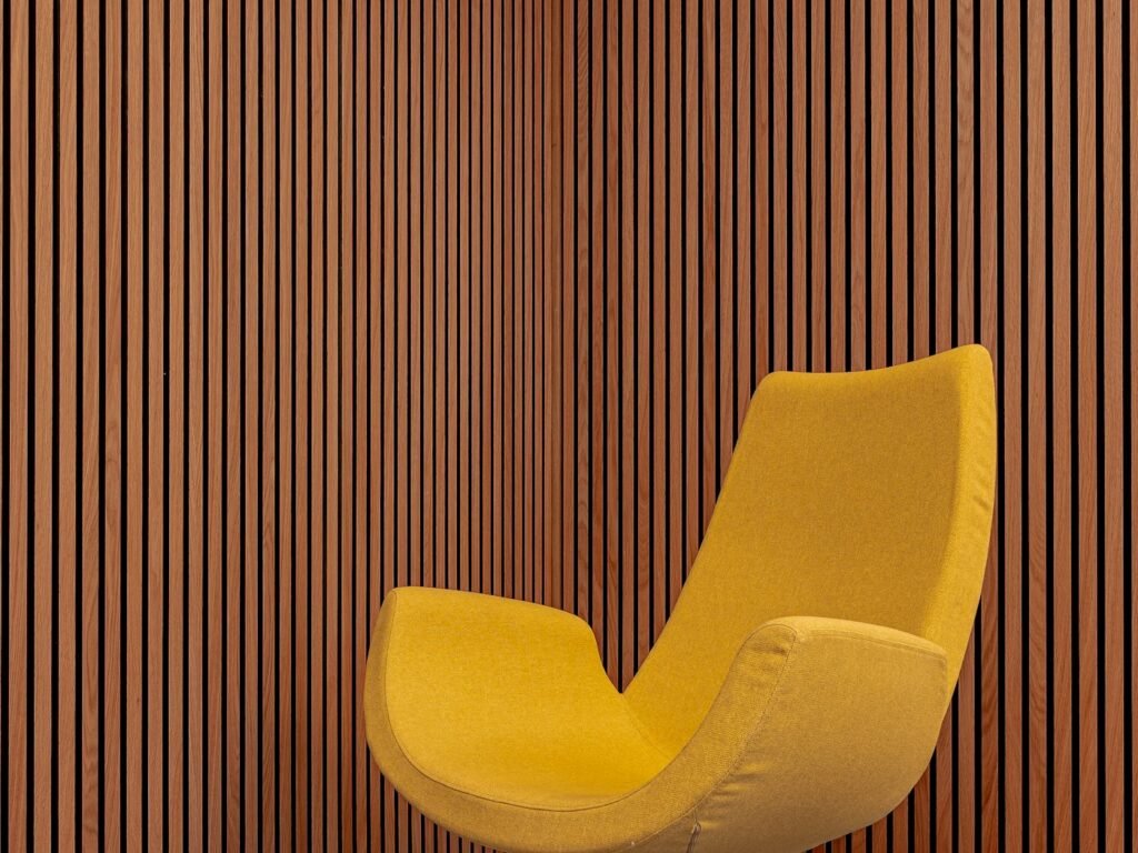 Lounge chair in front of a timber slat wall