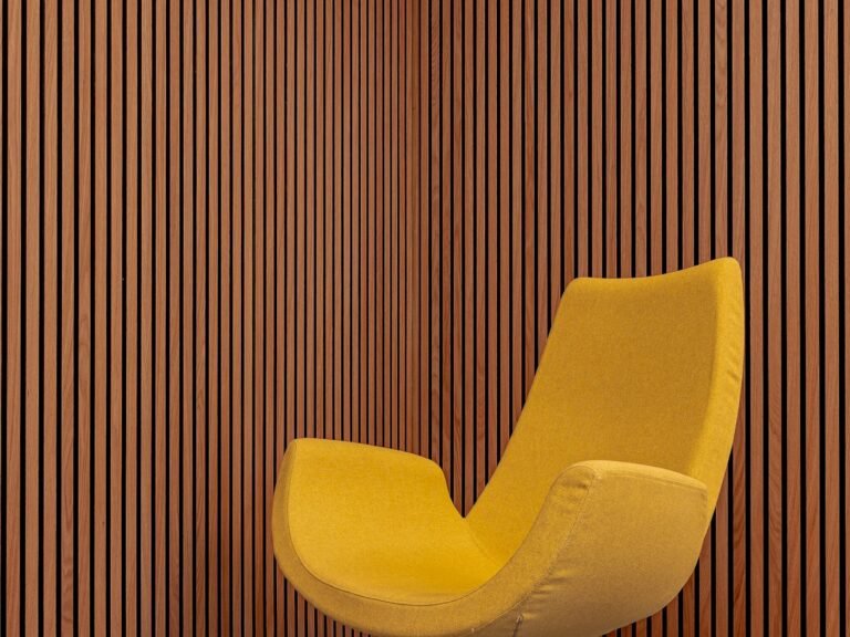 Lounge chair in front of a timber slat wall